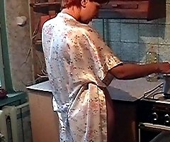 Amateur wife making coffee in the kitchen