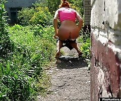 Redhead pussycat pulls her panties off to urinate
