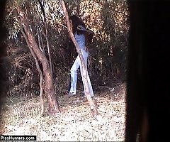 Curly hottie takes a wee under a tree
